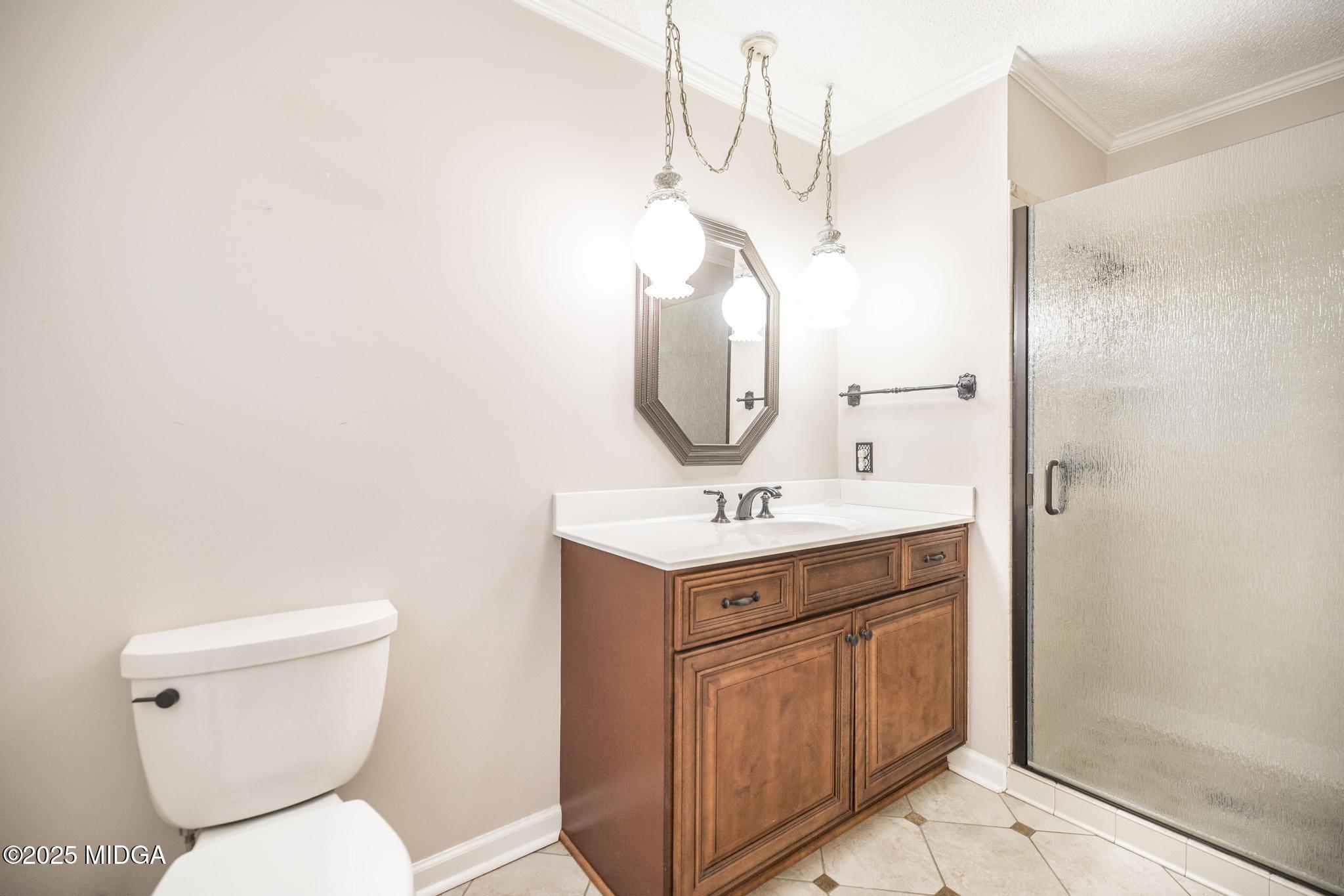 5812 Sardis Church Road Macon, GA 31216 - Photo 24 of 43 a bathroom with a toilet sink and mirror