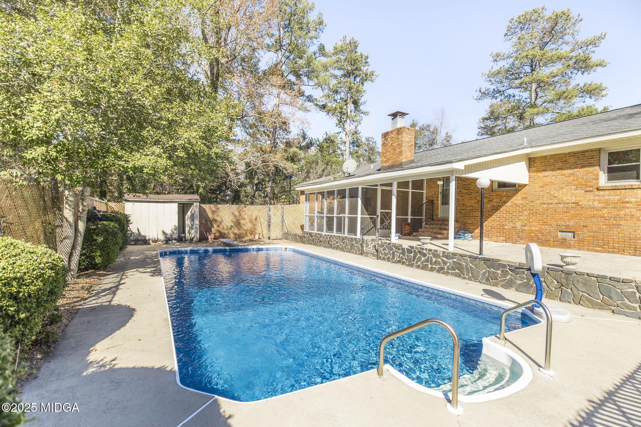 5812 Sardis Church Road Macon, GA 31216 - Photo 28 of 43 a view of a swimming pool with a patio
