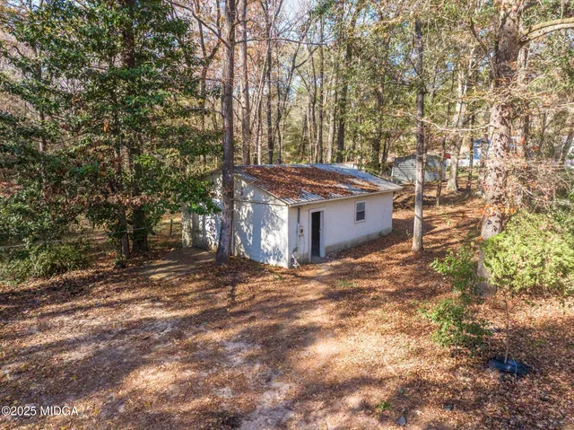 a view of an ocean with trees and houses
