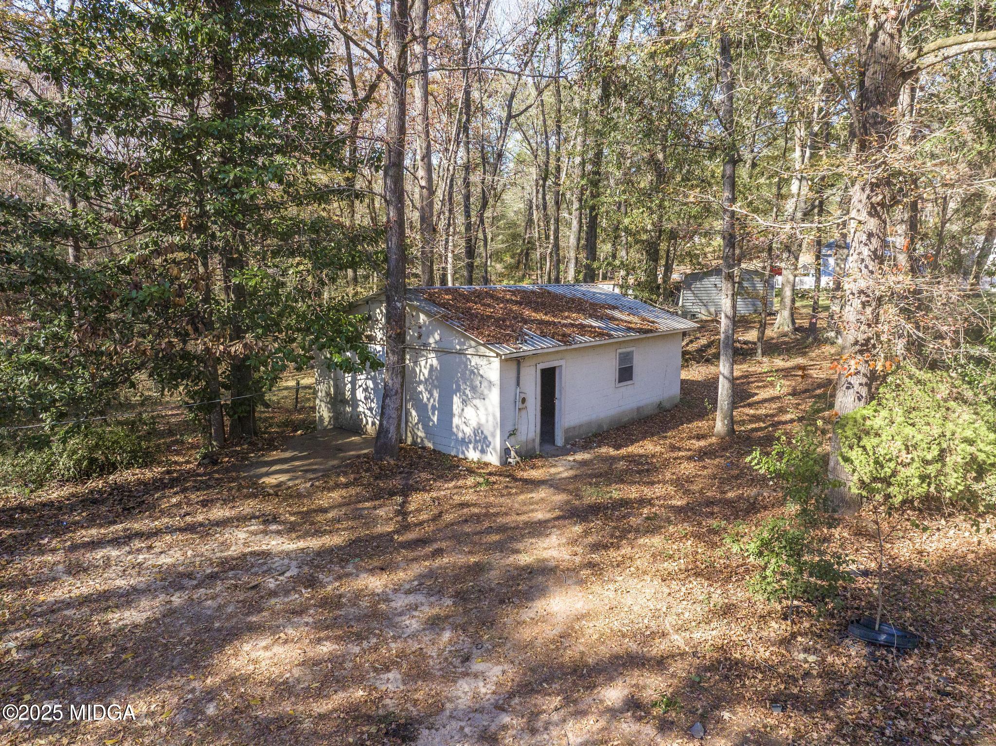 5812 Sardis Church Road Macon, GA 31216 - Photo 31 of 43 a view of a house with a yard