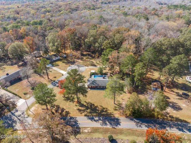 an aerial view of residential house with outdoor space