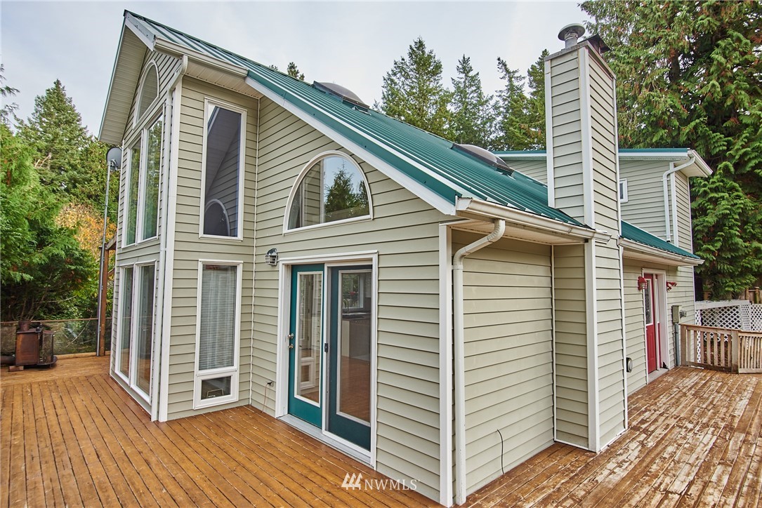 1966 Raleigh Drive Point Roberts, WA 98281 - Photo 1 of 21 a view of a house with a yard and wooden floor