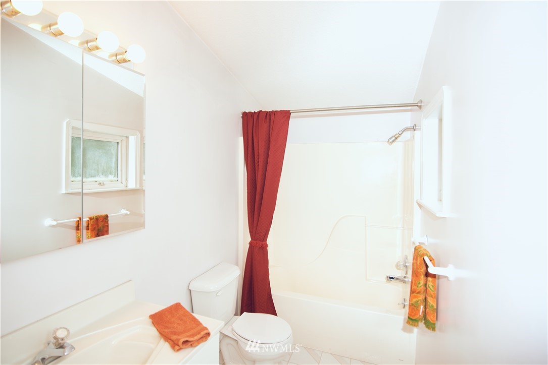 1966 Raleigh Drive Point Roberts, WA 98281 - Photo 21 of 21 a bathroom with a shower curtain and a sink