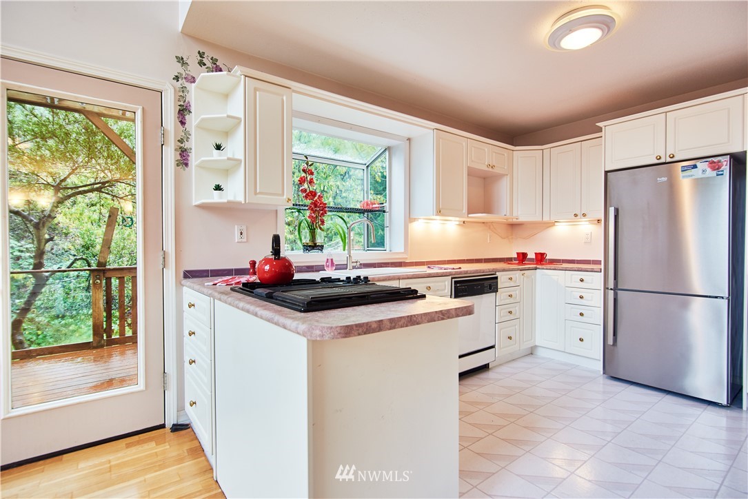 1966 Raleigh Drive Point Roberts, WA 98281 - Photo 8 of 21 a kitchen with a stove a refrigerator and a window