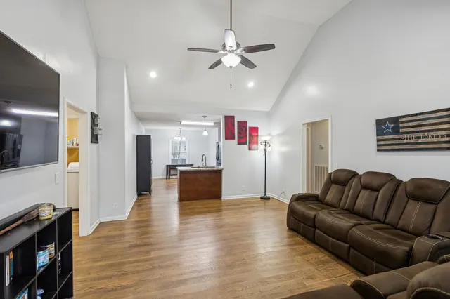a living room with furniture and a flat screen tv