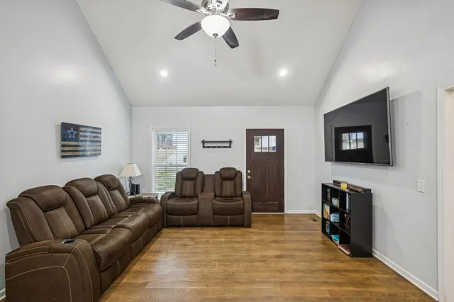 a kitchen with stainless steel appliances granite countertop a sink and a refrigerator