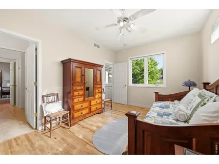 a bedroom with furniture and a window