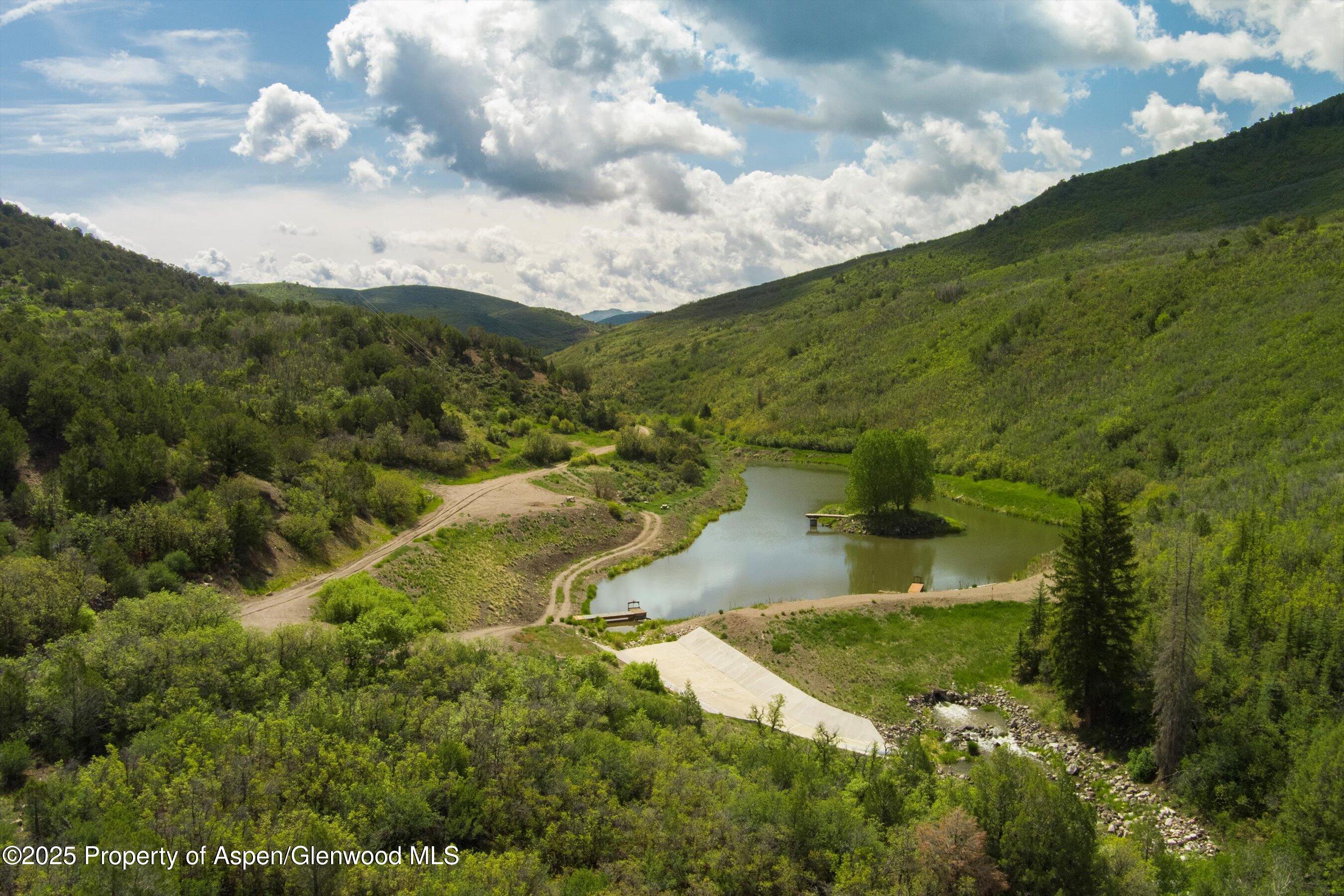 3691 East Sopris Creek Road Basalt, CO 81621 - Photo 3 of 21 a view of a lake with green space