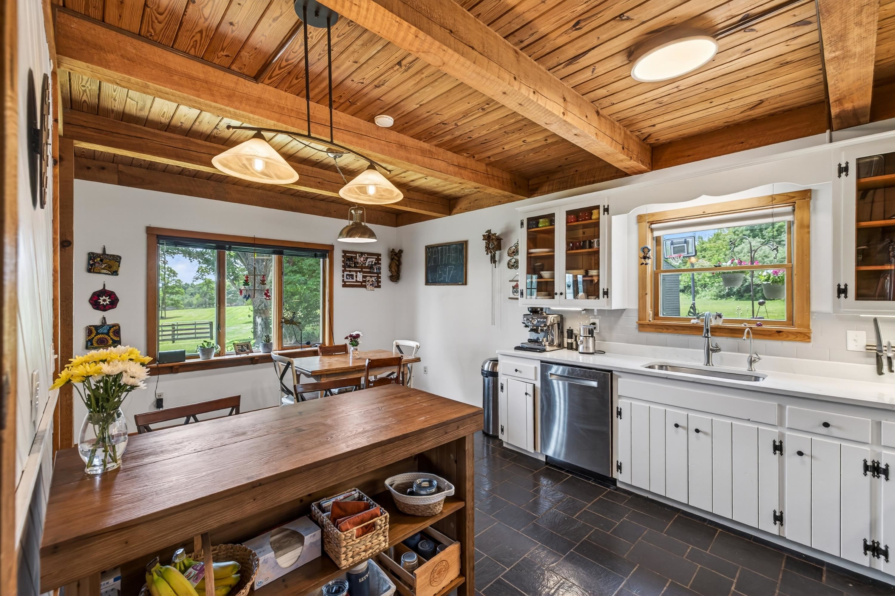 3980 Greenmount Road Harrisonburg, VA 22802 - Photo 19 of 75 The kitchen offers an eat-in dining area, white wooden cabinetry, large windows, and an abundance of cabinetry for storage. This home features stainless steel appliance and many more upgrades!