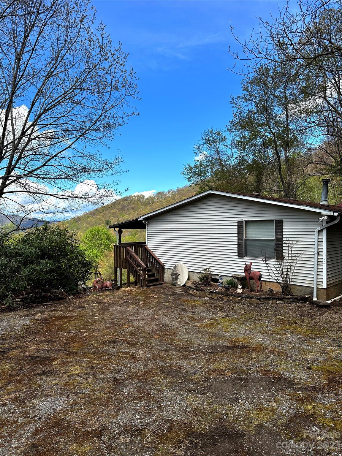 507 Matthew Lane Canton, NC 28716 - Photo 14 of 14 a backyard of a house with yard and garage