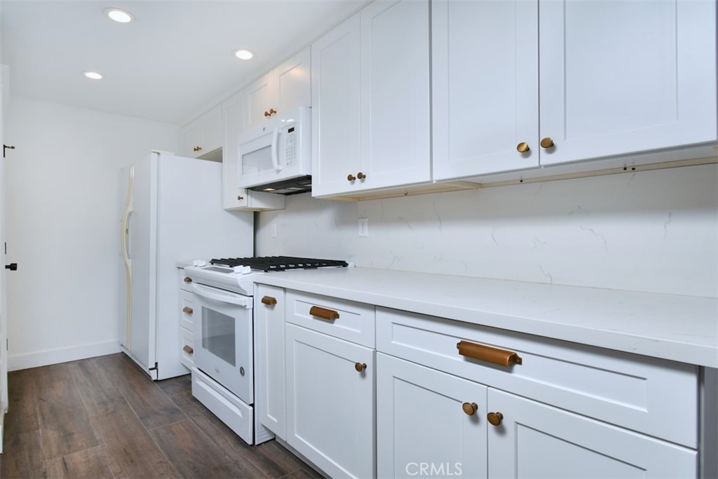 28159 Robin Avenue Saugus, CA 91350 - Photo 14 of 42 a kitchen with white cabinets and white appliances