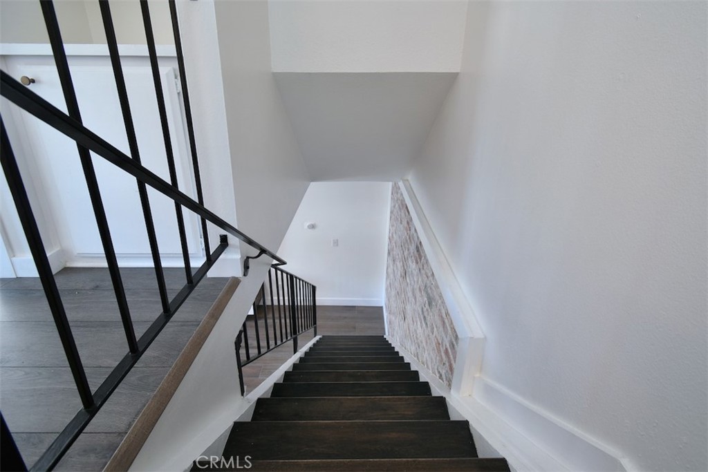 28159 Robin Avenue Saugus, CA 91350 - Photo 19 of 42 a view of staircase with wooden floor and white walls