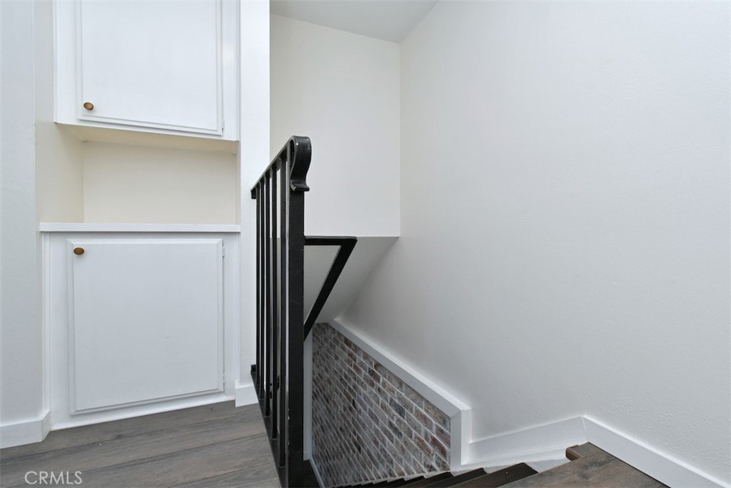 28159 Robin Avenue Saugus, CA 91350 - Photo 20 of 42 a view of hallway with stairs and wooden floor