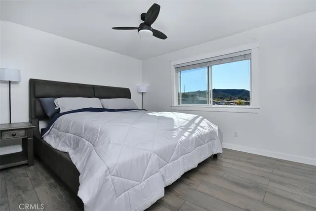 a bedroom with bed and window