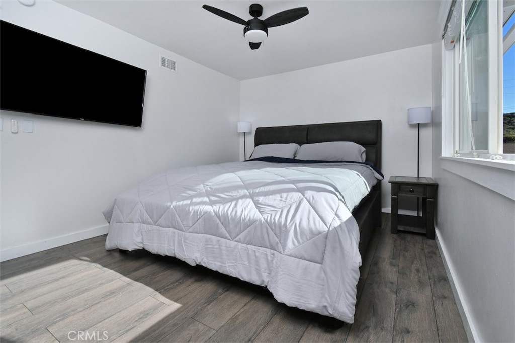 28159 Robin Avenue Saugus, CA 91350 - Photo 22 of 42 a bedroom with a bed tv and a window