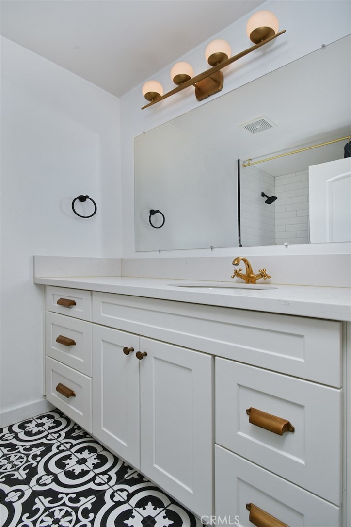 28159 Robin Avenue Saugus, CA 91350 - Photo 26 of 42 a bathroom with a sink and a mirror