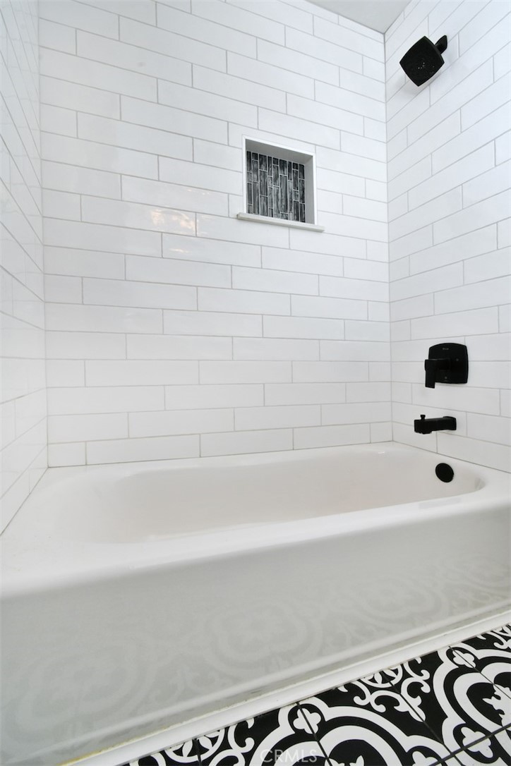 28159 Robin Avenue Saugus, CA 91350 - Photo 29 of 42 a bathroom with a bathtub and a shower