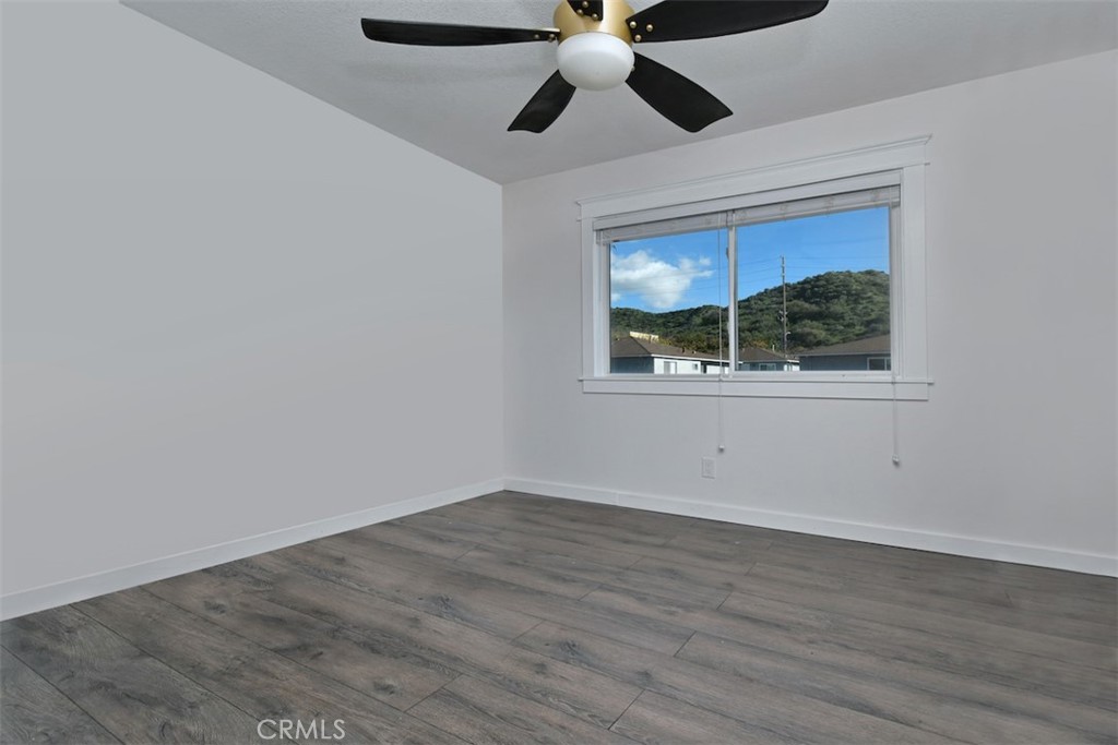 28159 Robin Avenue Saugus, CA 91350 - Photo 31 of 42 a view of an empty room with wooden floor and a window