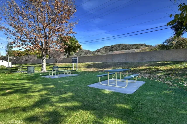 a view of a table and chairs in the garden