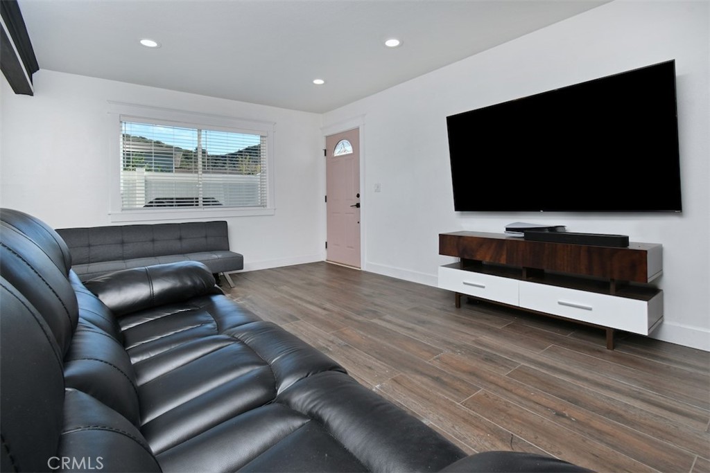 28159 Robin Avenue Saugus, CA 91350 - Photo 8 of 42 a living room with furniture and a flat screen tv