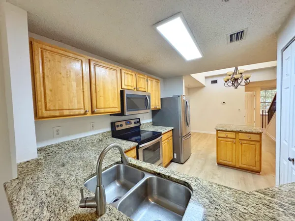 a room with wooden floor and furniture