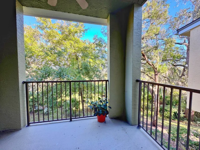 a view of a hallway with a chandelier and entryway