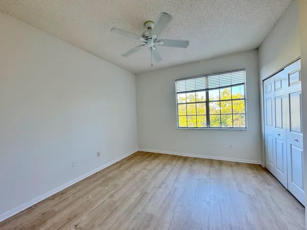 a view of a balcony with wooden floor