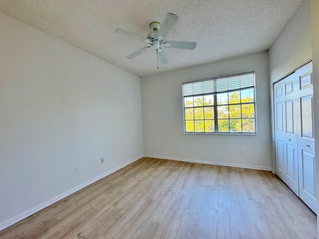 a view of a balcony with wooden floor