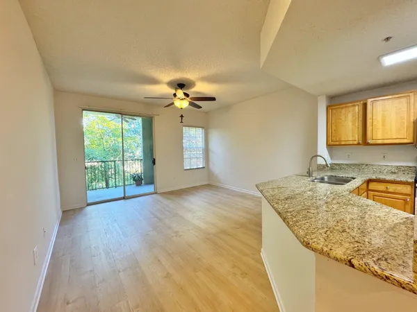 a view of a kitchen sink and natural light