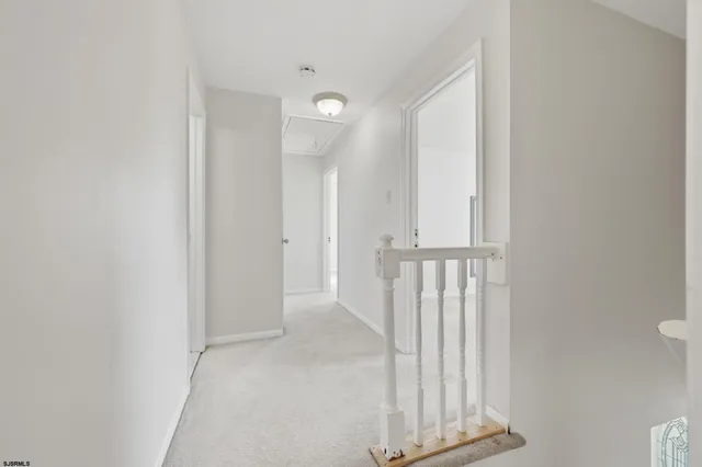 an empty room with an empty space and wooden door