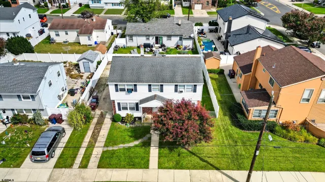 an aerial view of a house with a garden