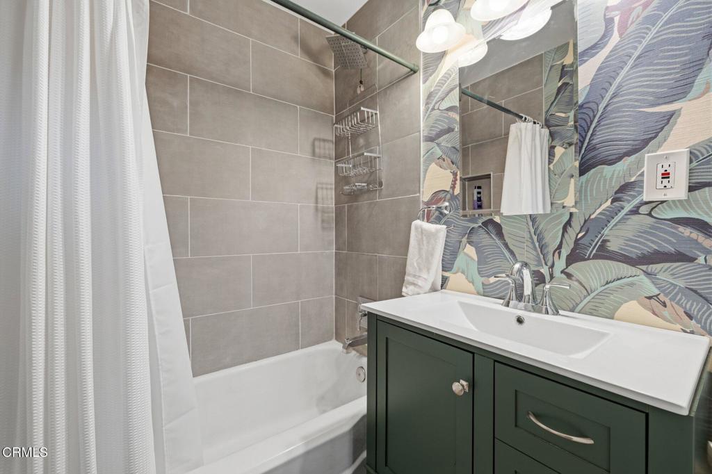 13934 Aztec Street Sylmar, CA 91342 - Photo 15 of 41 a bathroom with a sink and a mirror
