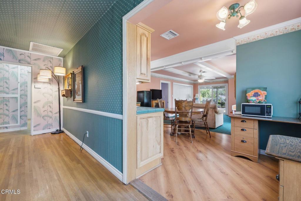 13934 Aztec Street Sylmar, CA 91342 - Photo 19 of 41 a very nice looking room with wooden floor and furniture