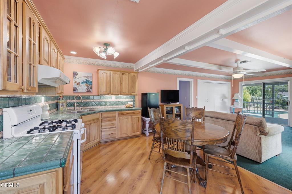 13934 Aztec Street Sylmar, CA 91342 - Photo 21 of 41 a view of a dining room with furniture and wooden floor