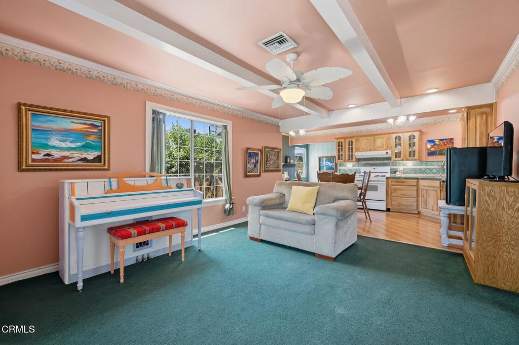 13934 Aztec Street Sylmar, CA 91342 - Photo 26 of 41 a living room with furniture and a flat screen tv