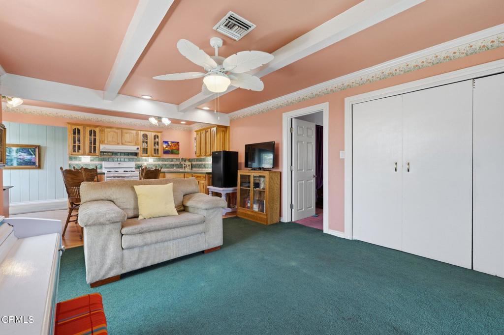 13934 Aztec Street Sylmar, CA 91342 - Photo 27 of 41 a living room with furniture and a view of kitchen