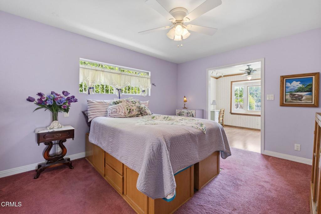 13934 Aztec Street Sylmar, CA 91342 - Photo 28 of 41 a bedroom with a bed and a chandelier