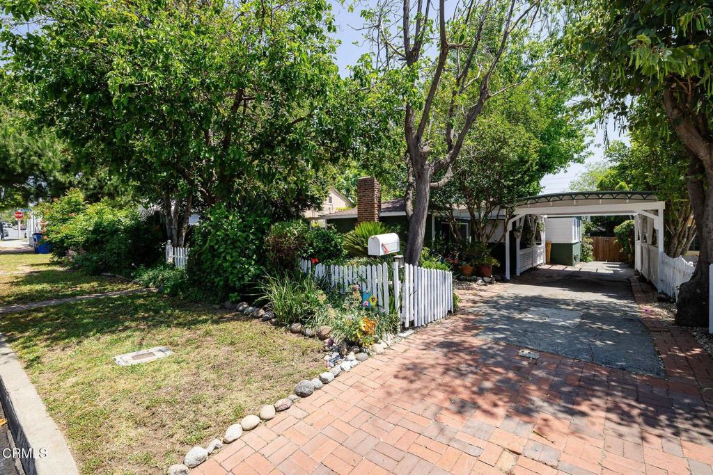 13934 Aztec Street Sylmar, CA 91342 - Photo 3 of 41 a view of a house with backyard and a tree