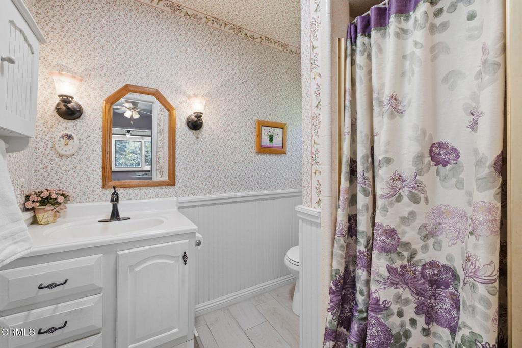 13934 Aztec Street Sylmar, CA 91342 - Photo 33 of 41 a bathroom with a sink vanity mirror and toilet
