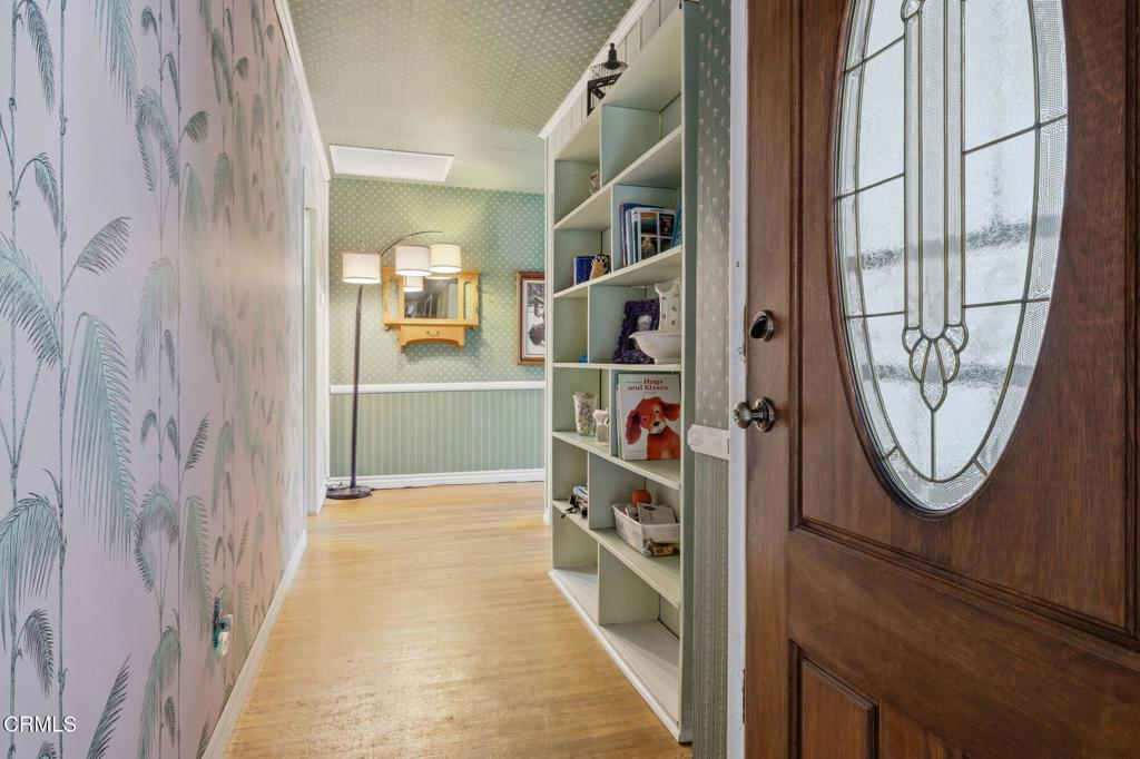13934 Aztec Street Sylmar, CA 91342 - Photo 10 of 41 a view of a hallway with wooden floor and windows