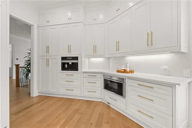 a living room with a large window and a table