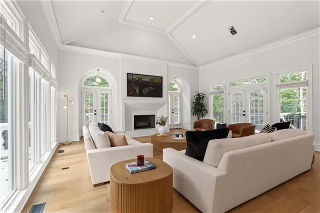 a bedroom with a bed and a flat tv screen on the dresser