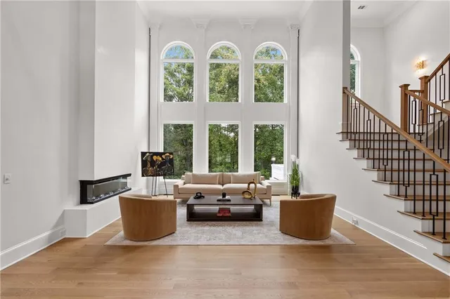 a spacious bedroom with a large bed and a window