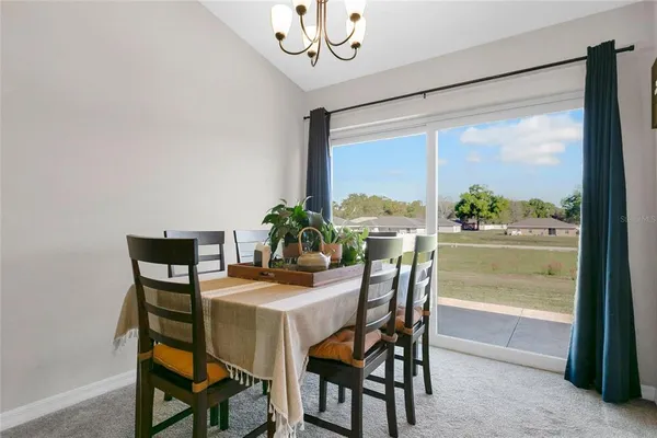 a dining room with furniture a window and a table