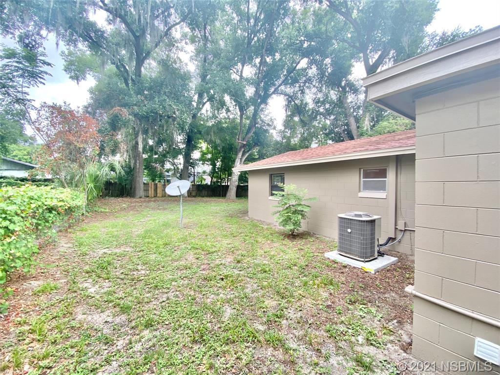 205 West Division Street DeLand, FL 32720 - Photo 2 of 15 a view of a house with a yard