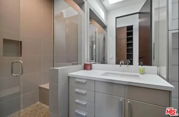 a bathroom with a sink and a mirror