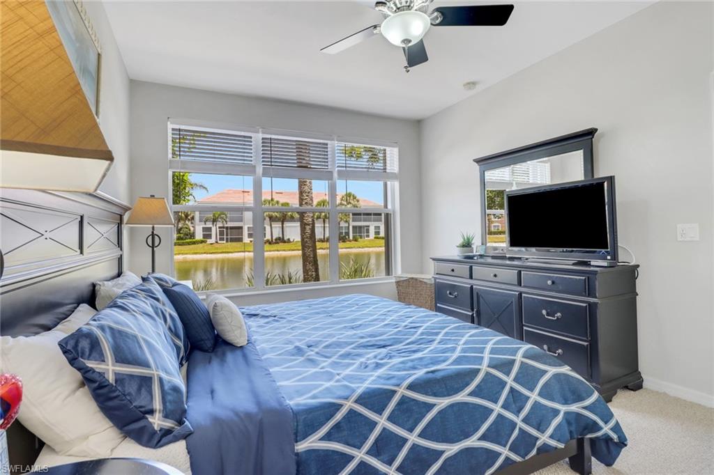11601 Navarro Way, Unit 2102 Fort Myers, FL 33908 - Photo 13 of 25 Carpeted bedroom featuring ceiling fan