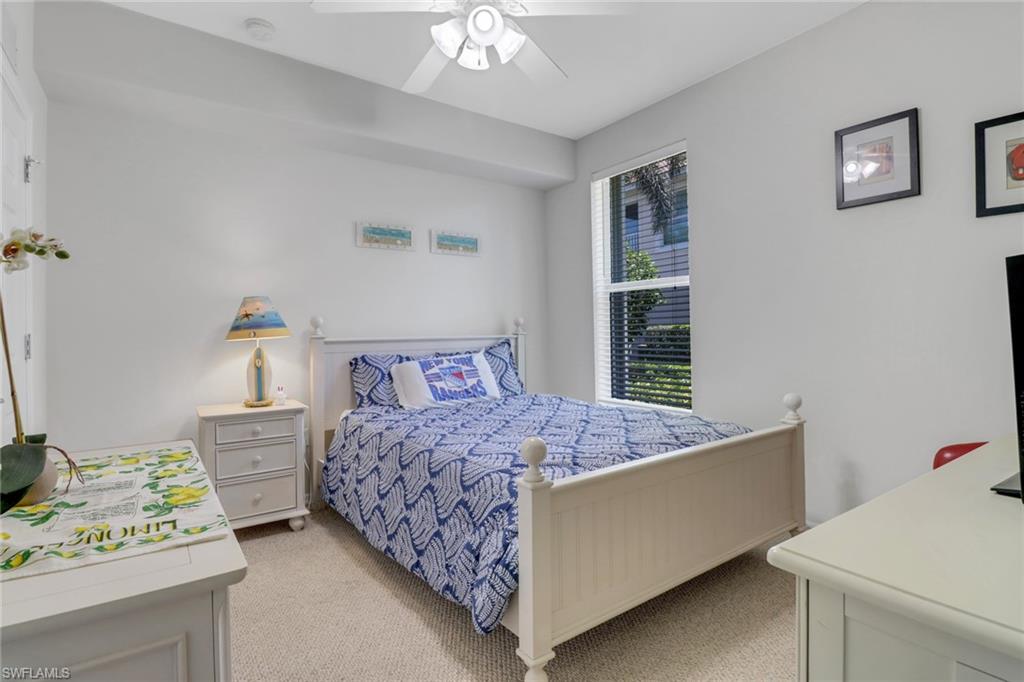 11601 Navarro Way, Unit 2102 Fort Myers, FL 33908 - Photo 17 of 25 Bedroom featuring light colored carpet and ceiling fan