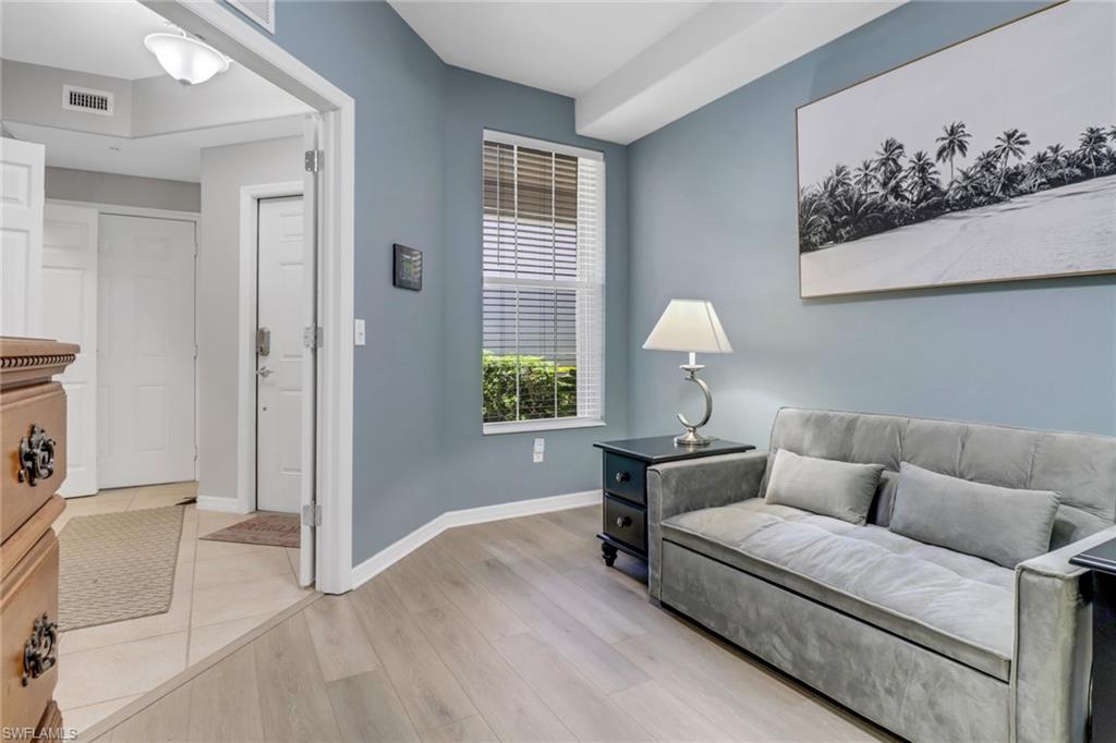 11601 Navarro Way, Unit 2102 Fort Myers, FL 33908 - Photo 20 of 25 Living area featuring light wood finished floors and baseboards