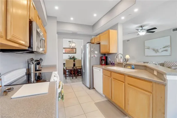 a kitchen with sink cabinets and outdoor view